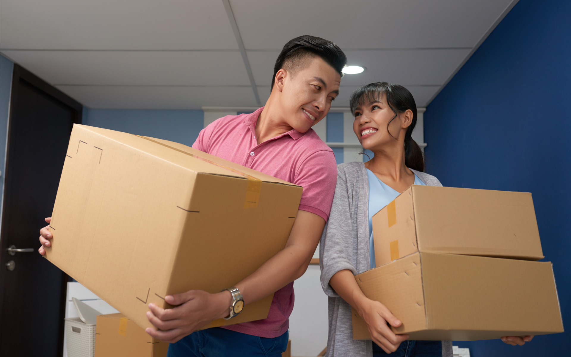 couples holding a box